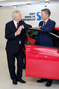 EDITORIAL USE ONLY Mike Hawes, SMMT Chief Executive (right) and David Davis, Secretary of State for Exiting the European Union (left), speak ahead of a meeting with executives from across the UK automotive industry to discuss the sector’s priorities for exiting the EU. PRESS ASSOCIATION Photo. Picture date: Monday 12 December 2016. Photo credit should read: Frantzesco Kangaris/PA Wire